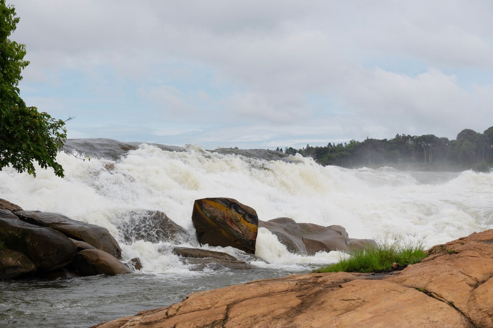 Vibrant shot of powerful rapids in the Nile River, Uganda, capturing natural beauty.
